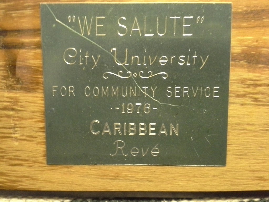 Engraved plaque saluting City University for community service, presented by Caribbean Revé